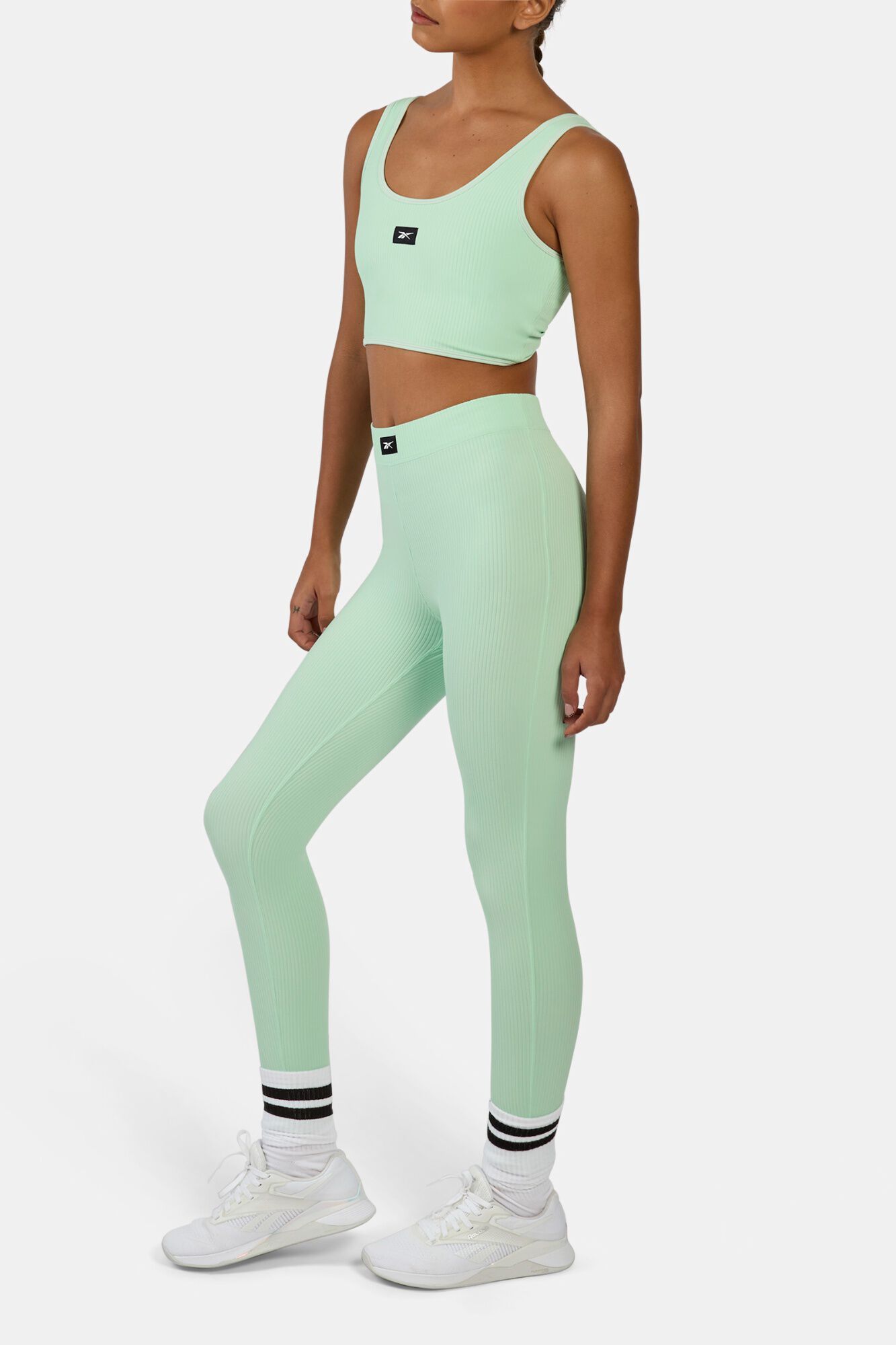 Reebok Malla acanalada con pu&ntilde;os de estribo
