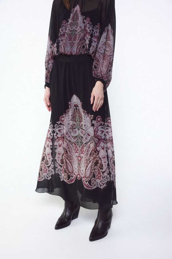 Conjunto de falda, bota y blusa